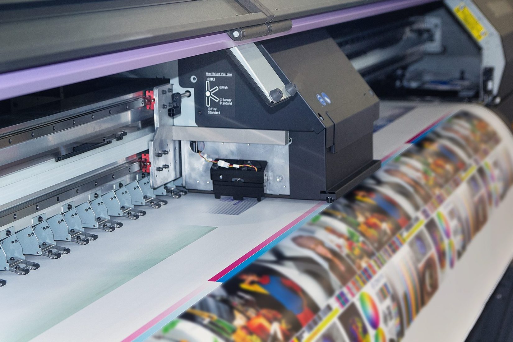 Large format printing machine in operation. Printing